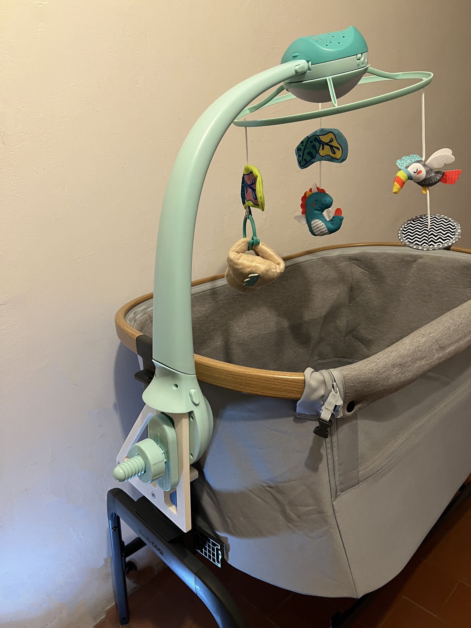 Adapter bracket used to attach the Infantino 3 in 1 musical mobile to co sleeper, shows full bedside crib